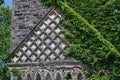 old gothic ivy covered stone college building