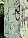 Old, graffitied columns in a row