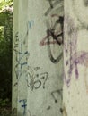 Old, graffitied columns in a row