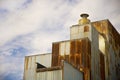 Old grain mill with rusty siding