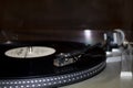 Old gramophone turntable with disc. Playing vinyl close up with needle on the record Royalty Free Stock Photo