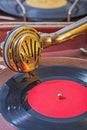 Old gramophone view on speaker on vinil disk Royalty Free Stock Photo