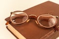 Old grandmother& x27;s glasses and a dilapidated book