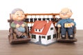 Old grandpa model and grandma model and small house model and calculation tool abacus Royalty Free Stock Photo