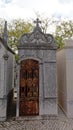 Old granite grave tomb with rusty iron cast door in Alto de Sao Joao cemetery in Lisbon,