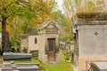 Old grave monuments and trees of Montmartre cemetery, Paris, France, Royalty Free Stock Photo