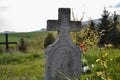 Old grave on traditional European cemetery in Slovakia. Aged cross tomb stone on grave yard in spring Royalty Free Stock Photo