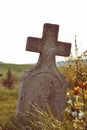 Old grave on traditional European cemetery in Slovakia. Aged cross tomb stone on grave yard in spring Royalty Free Stock Photo