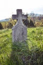 Old grave on traditional European cemetery in Slovakia. Aged cross tomb stone on grave yard in spring Royalty Free Stock Photo