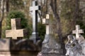 Old graves and crosses. Sculpture of a sitting angel.