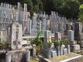 Old graves and headstones of the deceased at a Buddhist cemetery