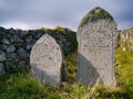 Old graves of the Jamieson family in a remote graveyard on the island of Unst in Shetland, Scotland, UK Royalty Free Stock Photo