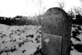 Old gravestone in snowy churchyard Royalty Free Stock Photo
