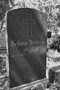 Old gravestone from before World War II. Artistic look in black Royalty Free Stock Photo