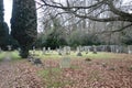 Old Graveyard with Broken and Fallen Crosses and Graves in Overgrown Grass Spooky