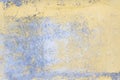 Old gray blue wall texture with peeling yellow paint background. Closeup Royalty Free Stock Photo