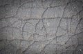 Old cracked asphalt texture or background. Vignetted. Closeup Royalty Free Stock Photo