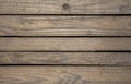 A old gray darkened wooden boards with black slots between them, horizontal lines. natural surface texture Royalty Free Stock Photo