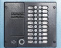 Old gray intercom on door