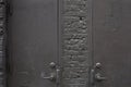 Old gray metal doors and bricks wall background Royalty Free Stock Photo