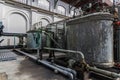 view of the industrial shop with a gray metal tanks with pipes. Vintage interior of the factory of the early 19th century Royalty Free Stock Photo