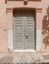 Old gray painted wooden door in old Plaka neighborhood, Athens, Greece. Royalty Free Stock Photo