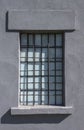 Old gray prison window with metal bars Royalty Free Stock Photo