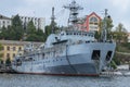 Old gray ship of the Russian Navy in the port of Sevastopol.