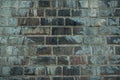 Old gray vintage weathered brick wall texture of ancient castle. Grunge rough block stonewall, masonry structure surface pattern Royalty Free Stock Photo