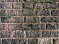 Old gray vintage weathered brick wall texture of ancient castle. Grunge rough block stonewall, masonry structure surface pattern Royalty Free Stock Photo