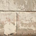 Old gray wall with peeling whitewash. Abstract texture macro shot. Royalty Free Stock Photo