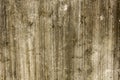 AOld gray white concrete wall with cracks and damage. concrete surface with moss and mold. rough texture. vertical lines