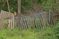 Old gray wooden fence wall with broken boards Royalty Free Stock Photo