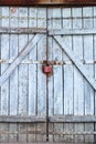 Old gray wooden plank gate with a padlock Royalty Free Stock Photo