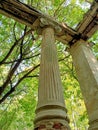 Old greek columns in ruined house in forest Royalty Free Stock Photo