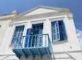 Old Greek House With Blue Window Shutters,Balcony And Door