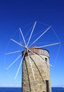 Old Greek Windmill against blue sky in Rhodes Royalty Free Stock Photo