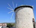 Old Greek Windmill against to New Wind Turbines Royalty Free Stock Photo