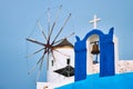 Old greek windmill on Santorini island in Oia town with stairs in street. Santorini, Greece Royalty Free Stock Photo