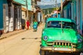 Old green american retro car parked on the street of Trinidad, Cuba