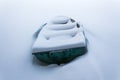 An old green boat in a frozen lake. Boat covered with pure snow Royalty Free Stock Photo