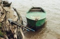 Old green boat with oars