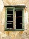 Old green broken window an abandoned house in Bakar,Croatia Royalty Free Stock Photo