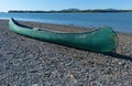 Old green canoe on shore Royalty Free Stock Photo