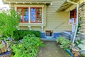 Old green cute craftsman style home.