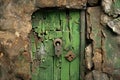 Old green door with lock and keyhole, closeup of photo Royalty Free Stock Photo