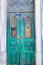Old green door locked with a chain and padlock Royalty Free Stock Photo