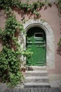 Old Green Door on Medieval Home with Stone Archway Royalty Free Stock Photo