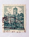 An old green east german postage stamp with an image of wartburg castle