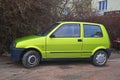 Old green Fiat Cinquecento parked